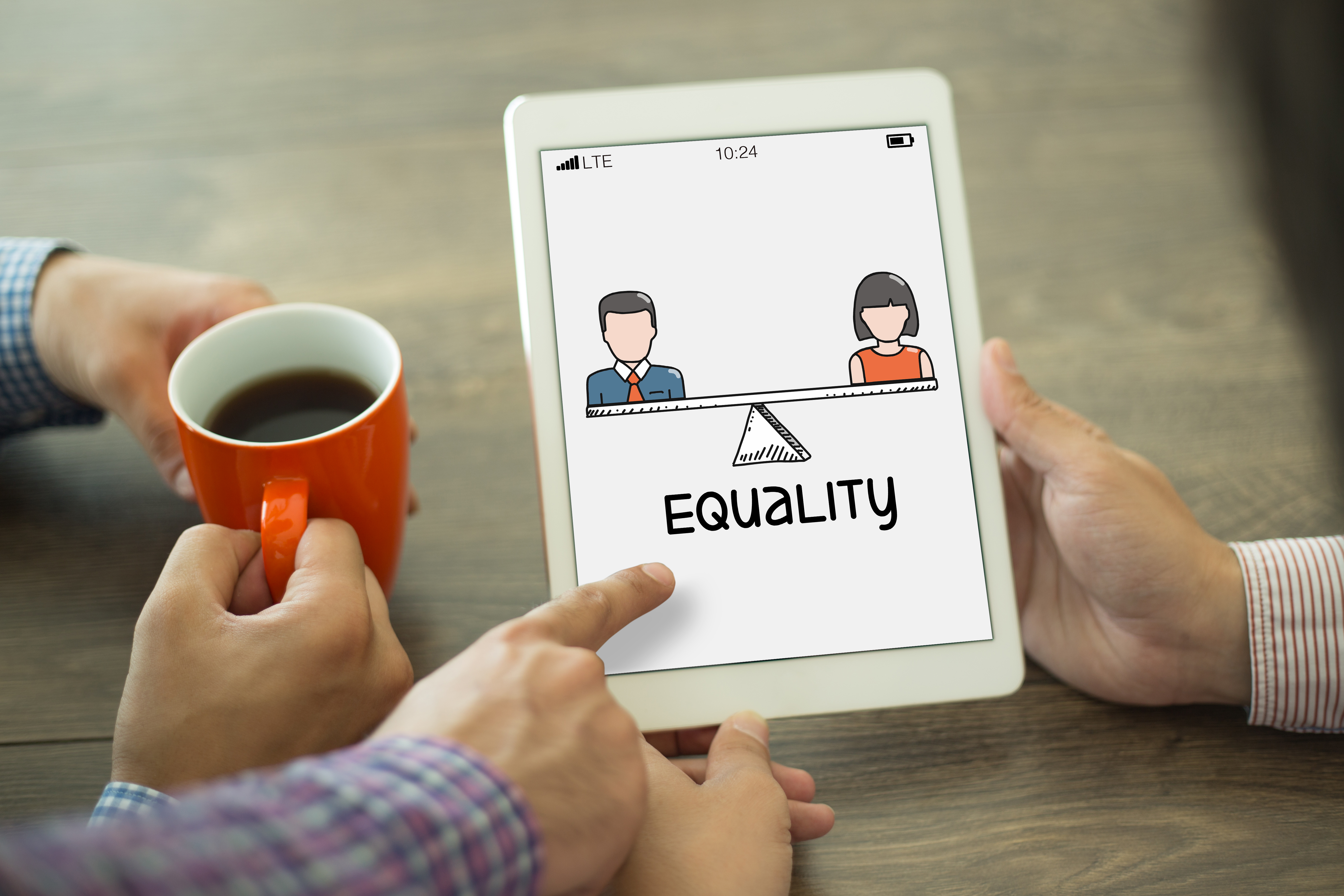 Image of a tablet with a male and female with the word "equality" in between demonstrating equal pay for equal work. 